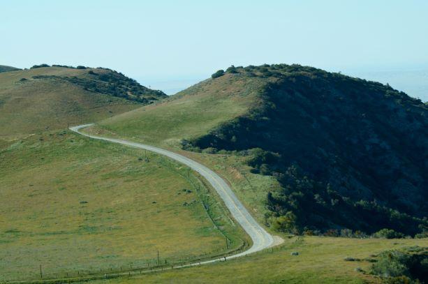 Photo of Hudson Ranch Road in green rolling hills