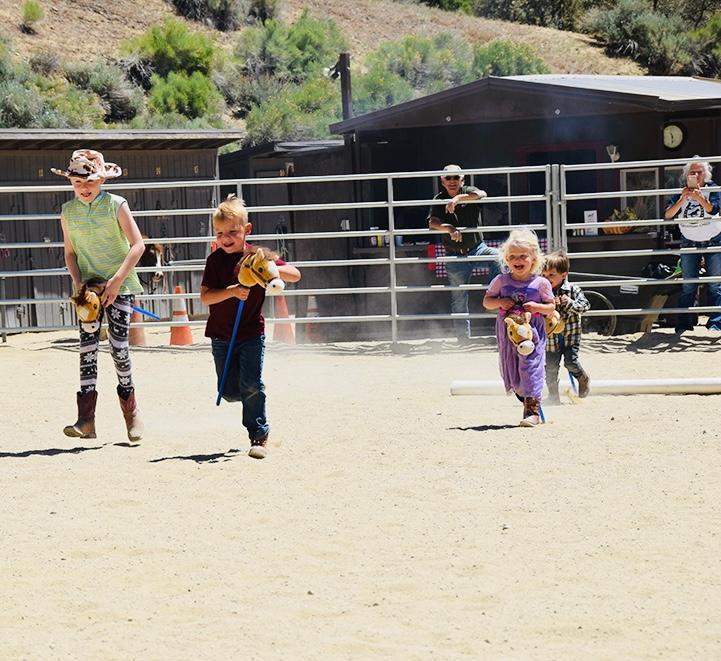 kids stick horse racing