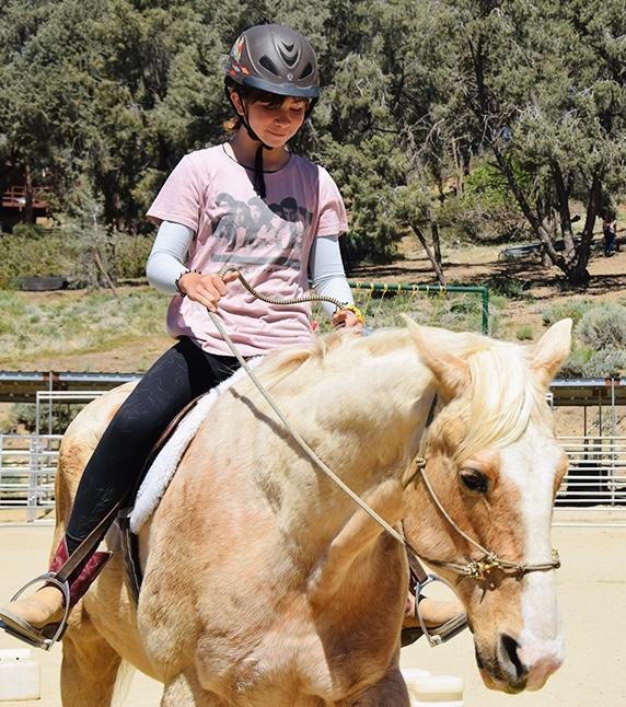 Child riding horse