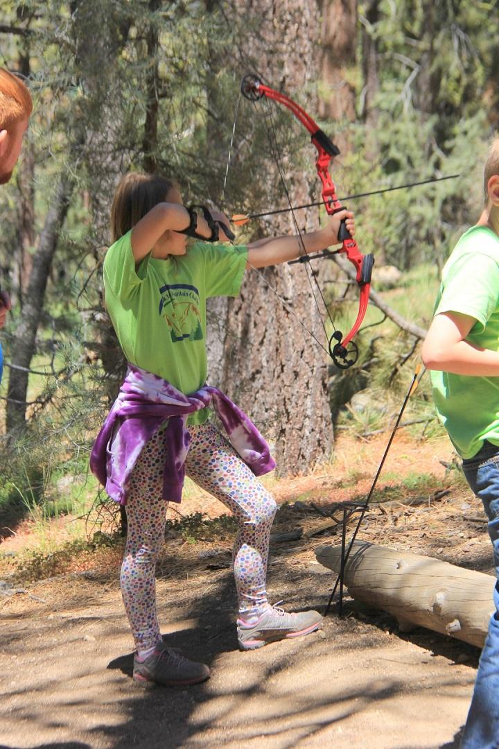 Photo of girl with bow and arrow